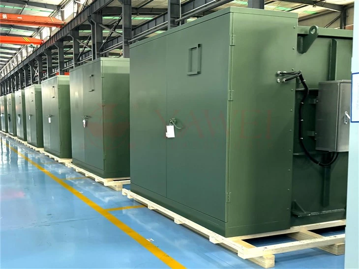 Rows of pad-mounted transformers on a manufacturing floor